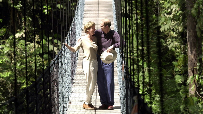 Prince Edward and Sophie cuddle on a bridge