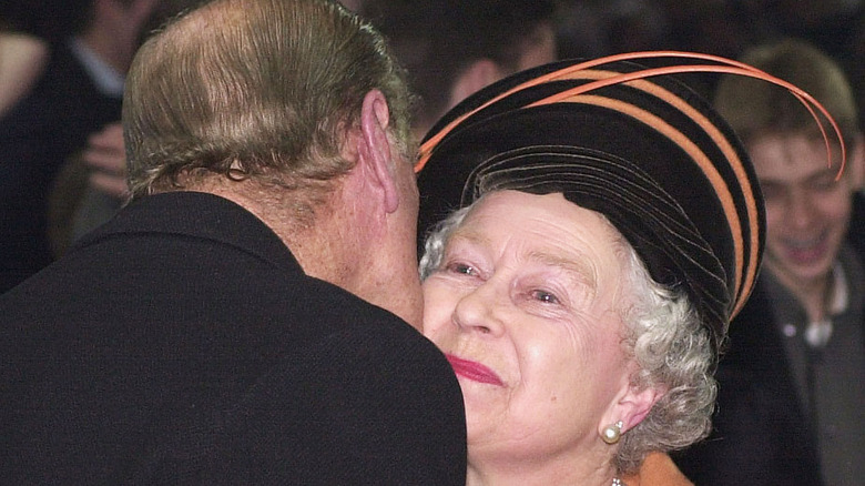 Prince Philip kissing Queen Elizabeth 