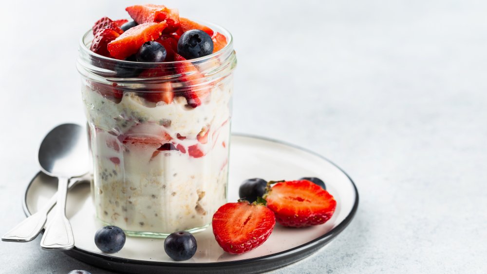 A jar of overnight oats with berries