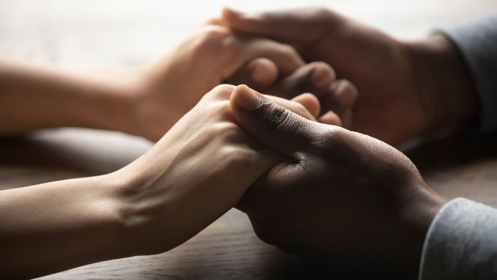 Couple holding hands