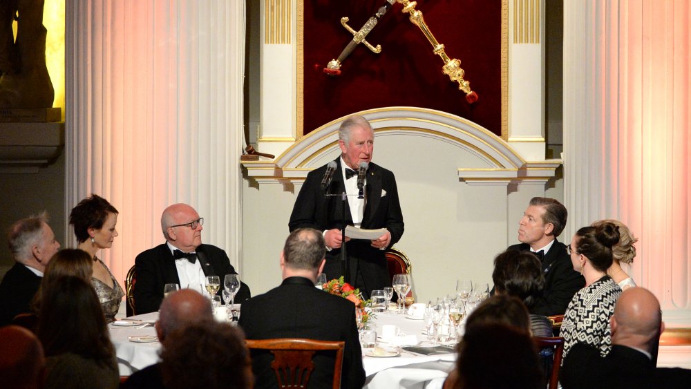 Prince Charles giving a speech at a meal