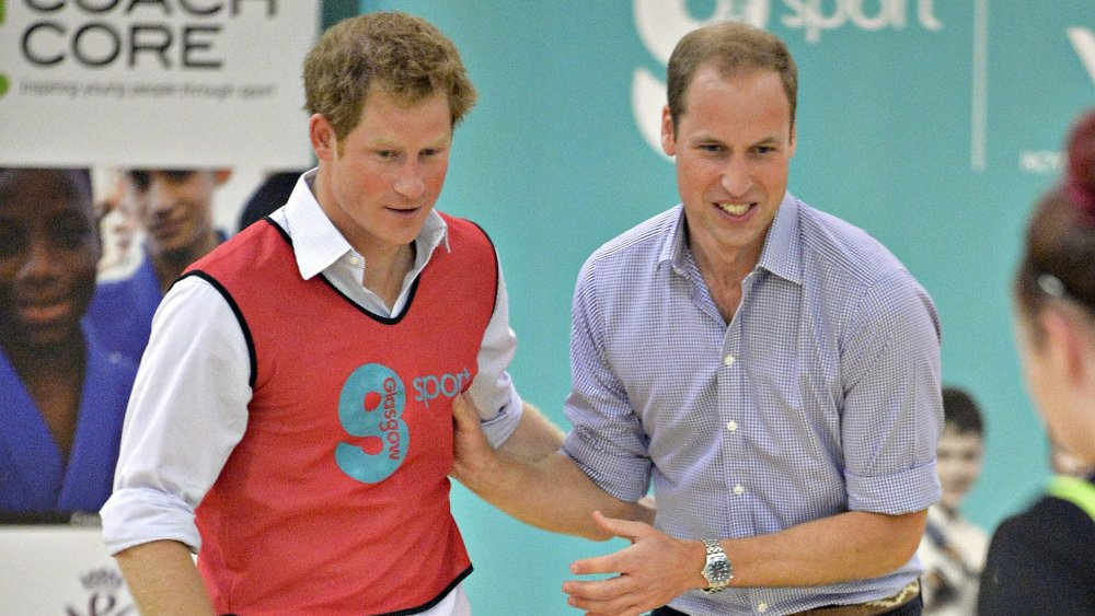 Prince Harry and Prince William playing soccer