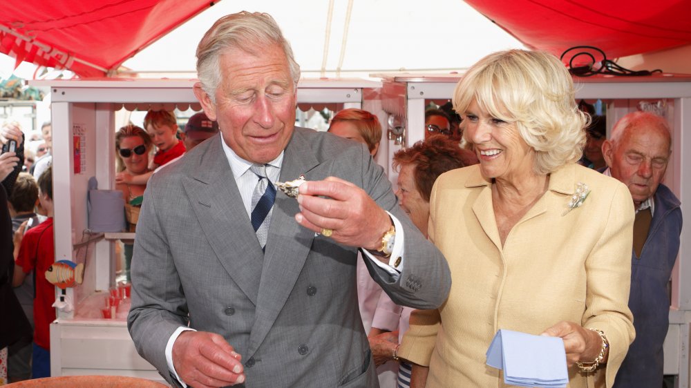 Prince Charles and his daughter at an oyster festival in 2013