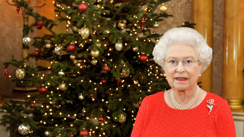Queen Elizabeth in front of a Christmas tree