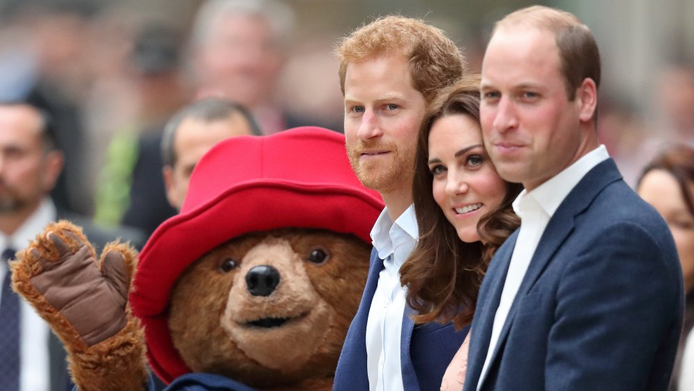 Prince Harry, Prince William, and Kate Middleton with Paddington Bear