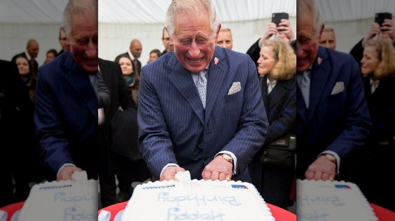 King Charles cutting birthday cake