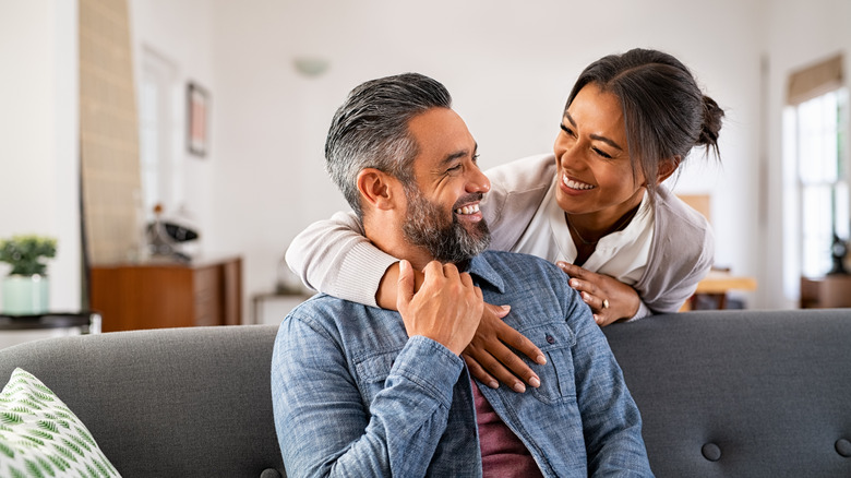 Woman hugging male partner