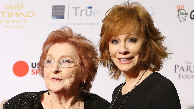 Reba McEntire and her mother Jackie McEntire smiling on the red carpet