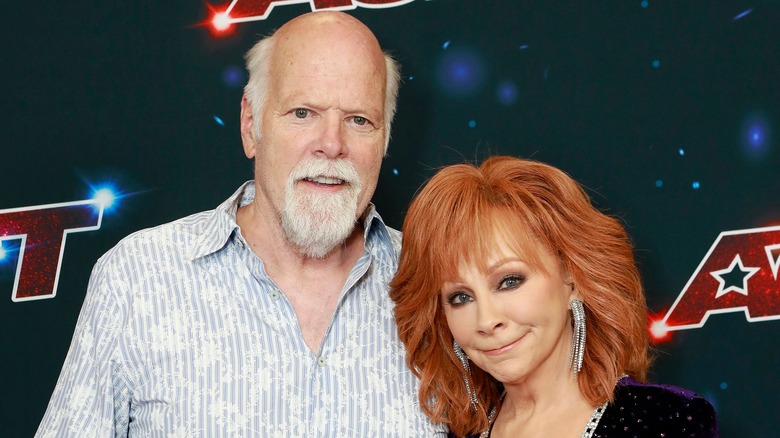 Reba McEntire and Rex Linn posing together