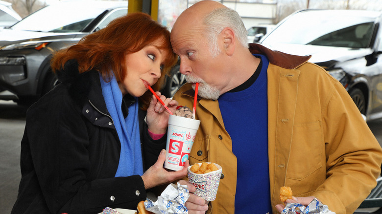 Reba McEntire, Rex Linn sharing Sonic drink