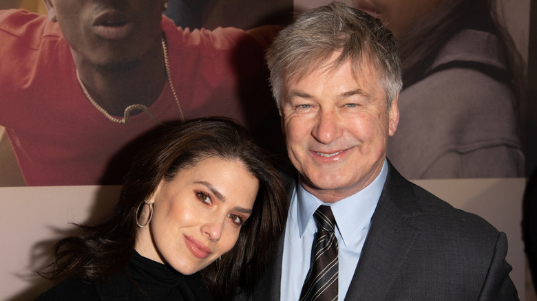 Hilaria Baldwin leaning on Alec Baldwin