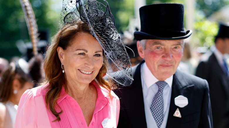 Carole and Michael Middleton smiling in event wear