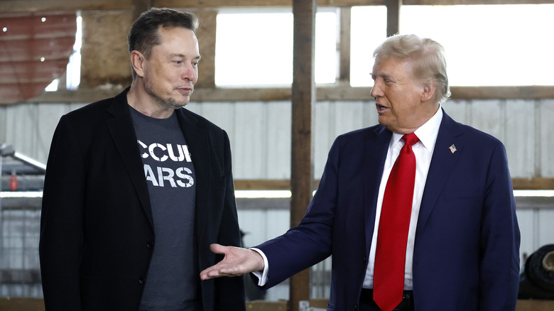 Donald Trump explaining something to Elon Musk