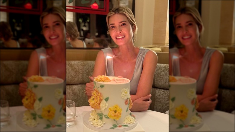 Ivanka Trump smiling with a large floral cake