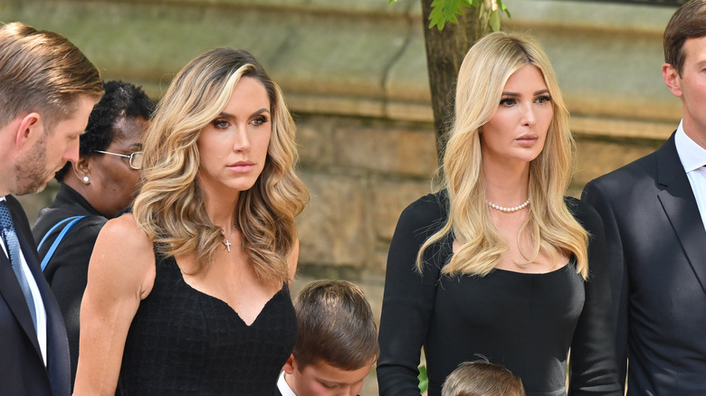 Lara and Ivanka Trump looking somber in black dresses