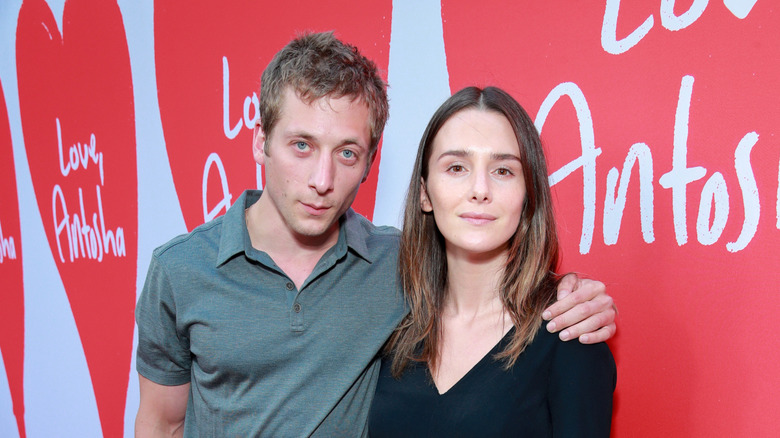 Jeremy Allen White and Addison Timlin smiling at the camera