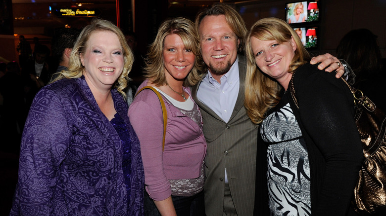 Kody Brown smiles with Janelle Brown, Meri Brown, and Christine Brown Woolley