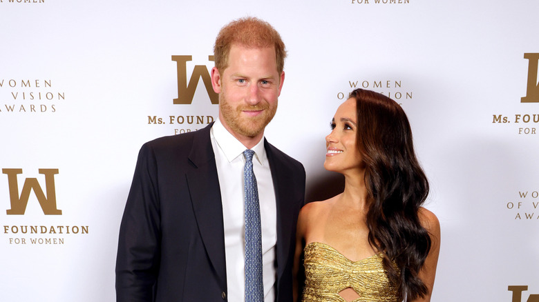 Meghan Markle smiling up at Prince Harry