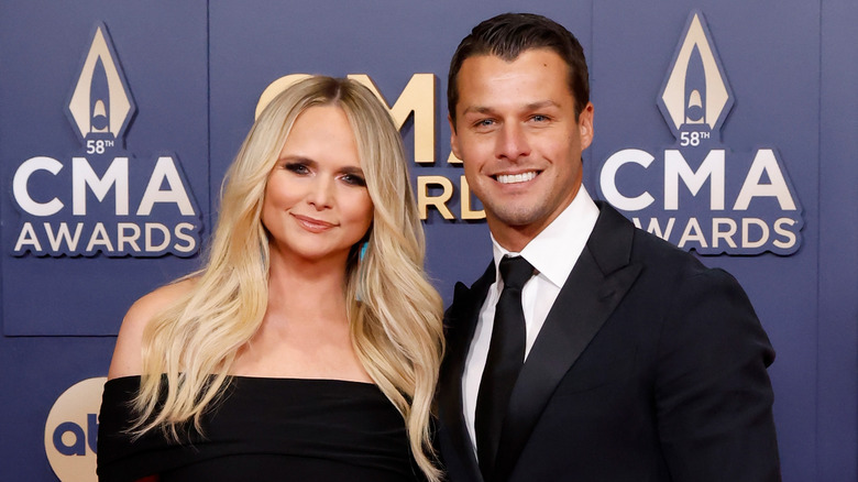 Miranda Lambert and Brendan McLoughlin pose on the red carpet for CMA Awards