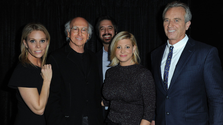 Cheryl Hines and RFK Jr. smiling with Larry David