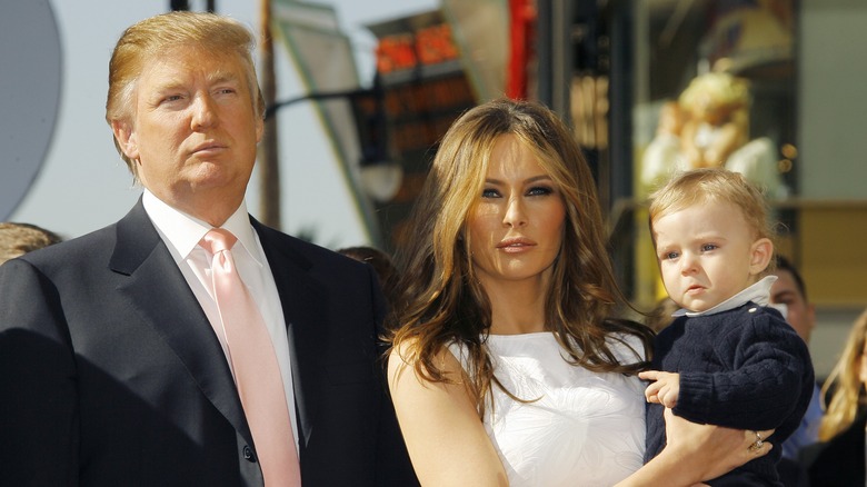 Donald and Melania Trump posing with baby Barron