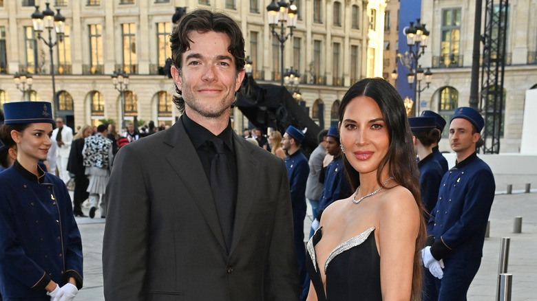 john mulaney and oliva munn smiling