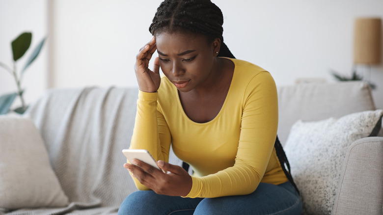 woman looking at phone