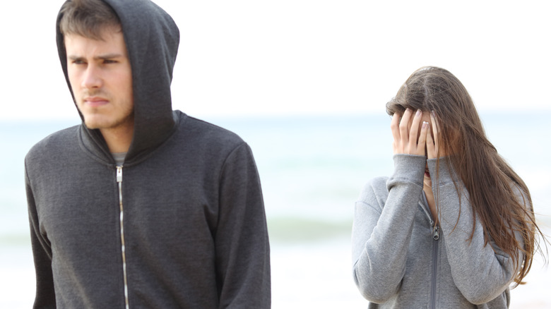 couple on unsuccessful beach date