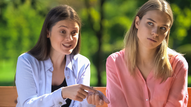 disinterested woman listening to a friend