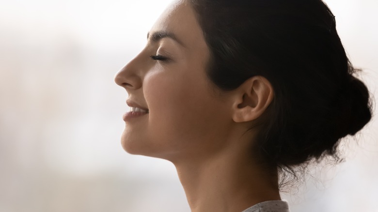 Serene, happy woman smiling