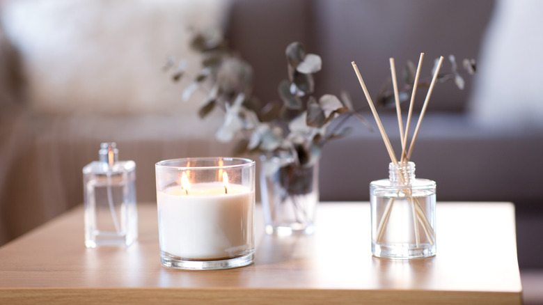 Reed diffuser and candle on coffee table