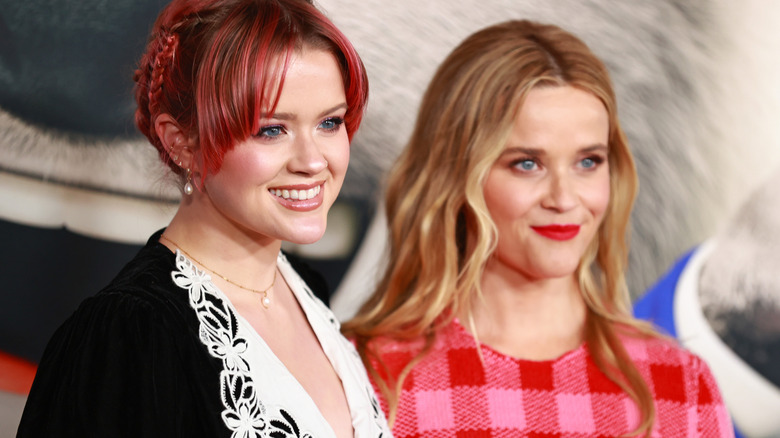 Ava Phillippe and her mom Reese Witherspoon smiling at an event 