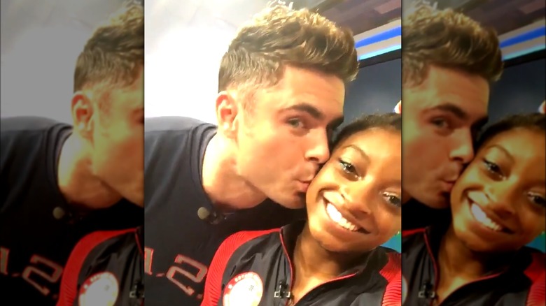 Zac Efron kissing Simone Biles on the cheek