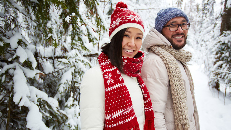 Asian couple smiling at each other