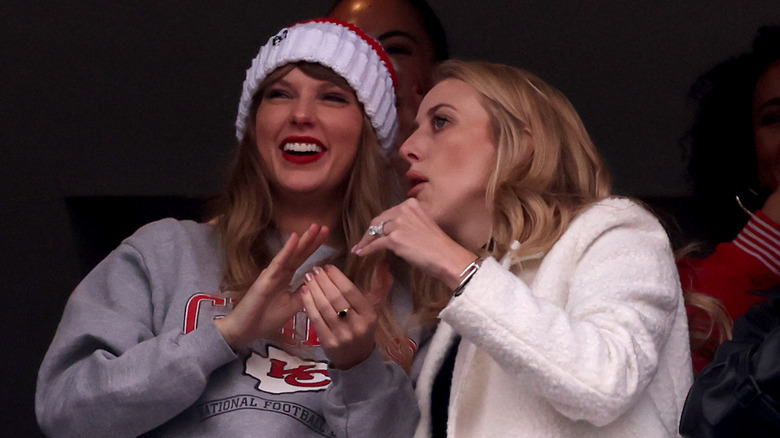 Brittany Mahomes whispering to Taylor Swift