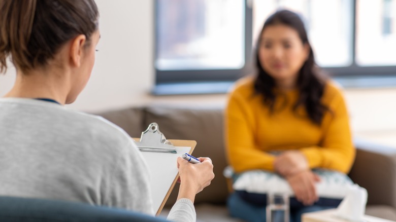 Woman speaks to therapist