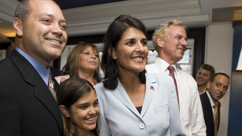 Rena Haley smiling with her parents