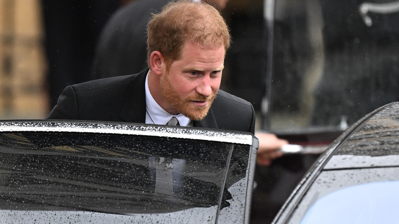 Prince Harry getting into a car