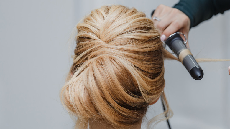 Woman with blonde chignon