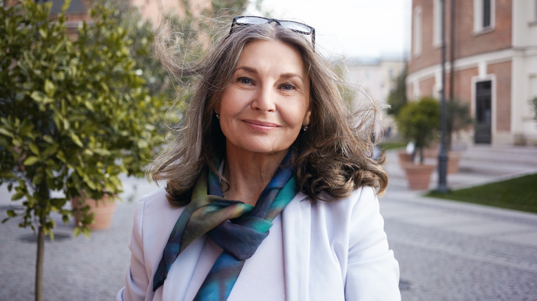 Woman smiling in silk scarf