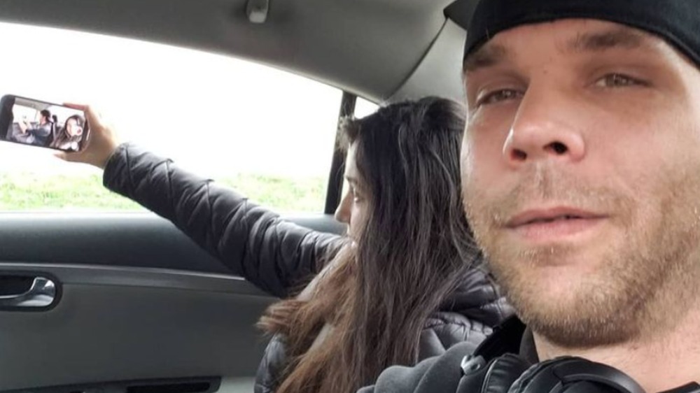 Carmela takes a car selfie of herself and husband Jeremiah