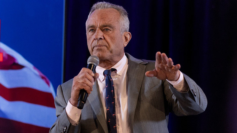 RFK Jr speaking on stage at an event