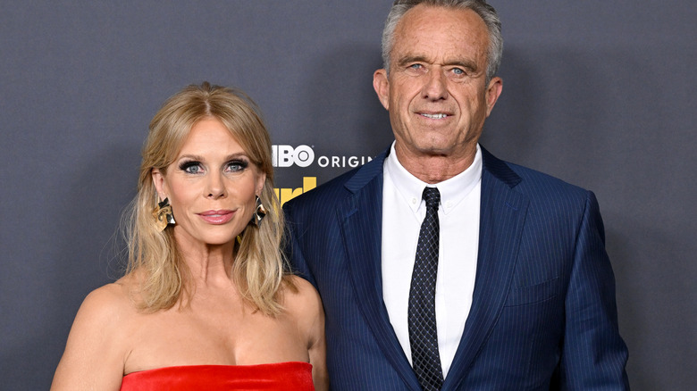 Cheryl Hines and RFK Jr. posing together on the red carpet