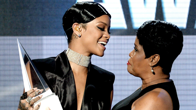 Rihanna smiling at her mother