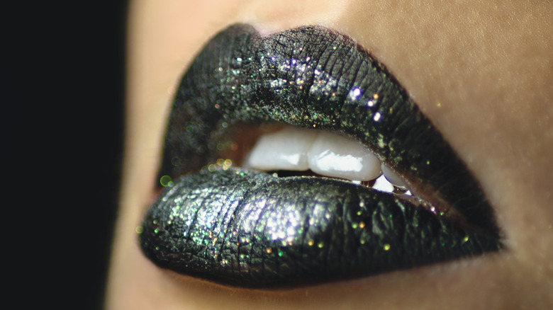 black glitter lipstick on woman