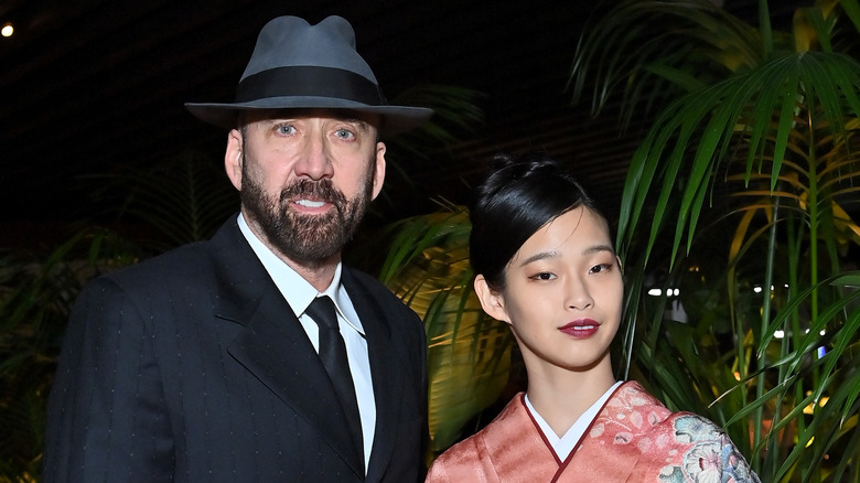 Nicolas Cage and Riko Shibata standing next to each other at an event