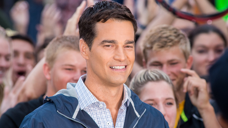 Rob Marciano smiling with a crowd