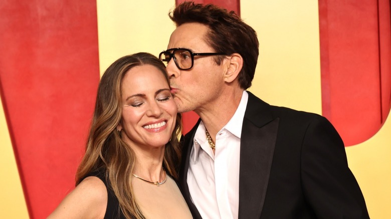 Robert Downey Jr. kissing Susan Downey