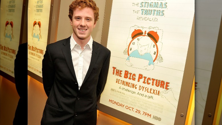 Dylan Redford posing at premiere