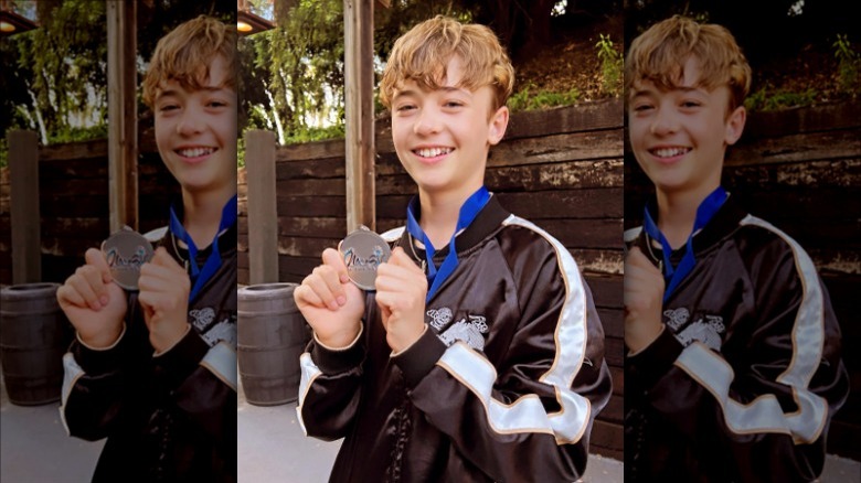 Julian Thicke smiling with medal